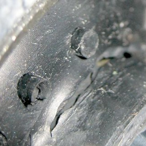 Figure 1: Cracks in a rubber part (suspension bushing) after injection molding   (c) SIGMA Engineering GmbH